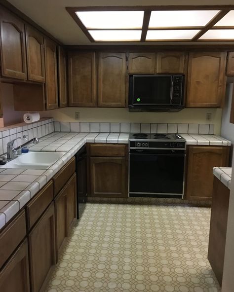 Wooden cabinets in kitchen before renovation. 1980 Kitchen, Modern Tile Backsplash, 1980s House, 1980s Kitchen, 80s Kitchen, 80s House, Before After Kitchen, 80s Home, 80s Interior