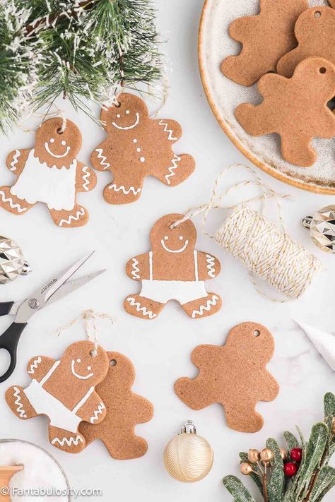 This DIY recipe for salt dough gingerbread ornaments shows you how to make these fun little Christmas crafts! Whether you decorate them or leave them blank, they're so cute and they use simple ingredients. Salt Dough Christmas Ornaments Ideas, Cardboard Gingerbread Ornaments, Salt Dough Gingerbread Ornaments, Homemade Dough Ornaments, Gingerbread Salt Dough Recipe, Diy Cookie Ornaments, Diy Gingerbread Man Ornaments, Gingerbread Christmas Ornaments Diy, Gingerbread Salt Dough Ornaments