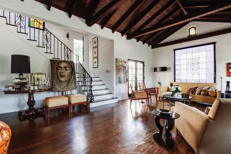 A Cozy Spanish-Style on Hollywood Boulevard Seeks $2.8M - Dwell Spanish Revival Interior, Bg House, Modern Spanish Revival, Red Brick Fireplaces, Spanish Colonial Homes, Spanish Revival Home, Santa Barbara Style, High Ceiling Living Room, 1920s House