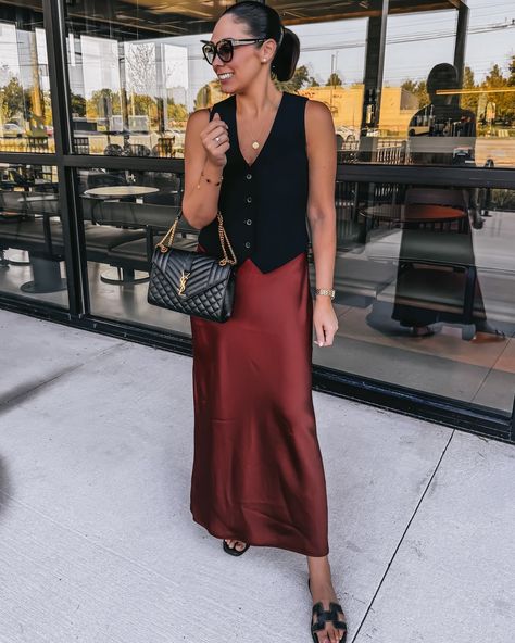 Effortlessly Chic: How to Style a Vest and Satin Dress for an Elevated Look Love this look? Shop each piece and recreate this elevated style through my LTK! Tap the link in bio to explore more outfit inspo. https://liketk.it/4Sy2E chic, versatile outfit, black button-up vest, satin skirt—elevated style, comfortable outfit, timeless style, YSL bag, black slides, classic outfit, Aritzia #aritziaoutfits #vestoutfit #autumnoutfitinspo #ltkfall Vest And Skirt Outfits For Women, Button Vest Outfits, Vest And Skirt Outfit, Vest Dress Outfit, Style A Vest, Dress With Shirt Underneath, How To Style A Vest, How To Style A Slip Dress, Recreate Outfits