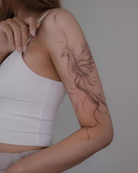 Pheonix Tattoo For Women Simple, Phoenix Upper Arm Tattoo, Floral Phoenix Tattoo, Ornamental Phoenix Tattoo, Phönix Tattoo Women Arm, Fine Line Pheonix Tattoo For Women, Phoenix Tattoo On Arm, Fineline Phoenix Tattoo, Phoenix Tattoo Arm For Women