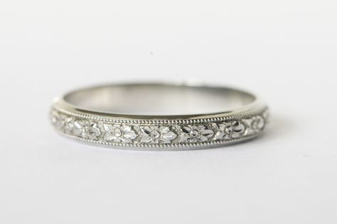 Beautiful 18k white gold engraved wedding band!  This band is wider than the typical engraved band which gives it the space needed for all the details to really show!  The center of the band has intricate flowers with a milgrain border.  There is a small band of plain white gold on either side and it gives the band such an elegant look.  Inside it has the 18k hallmark along with the lion that is Blancard & Co.'s hallmark.  They were a New York jeweler in the early to mid 20th century and made go White Gold Band Ring, White Gold Bands Women, Marriage Ring White Gold, Wedding Bands For Women Platinum, Engraved Wedding Bands For Women, Wedding Bands For Women White Gold, Wedding Bands For Women Silver, Vintage Wedding Rings White Gold, Wedding Bands White Gold