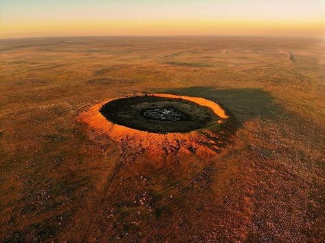 Now this is something you don't see every day! ☄️ Located on the edge of the Great Sandy Desert in the @AustraliasNorthWest's East… Sandy Desert, Meteor Impact, Bush Pilot, Impact Crater, Wolf Creek, Great Ocean Road, Northern Territory, Sense Of Place, South Australia