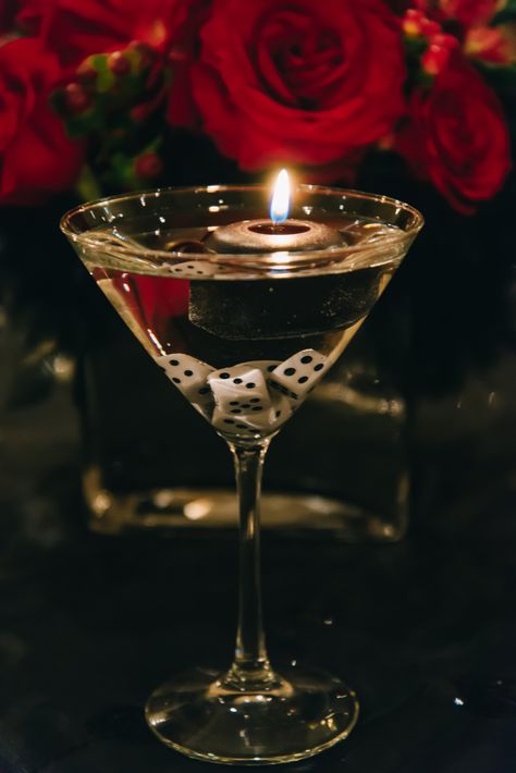 Floating candles and dice in martini glass - a fun decorative table accent for formal event. Tema Vegas, Mafia Theme Party, Harlem Nights Theme Party, James Bond Theme Party, Harlem Nights Party, Harlem Nights Theme, Mafia Party, Casino Birthday Party, 007 Casino Royale