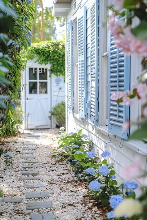 8 Coastal Cottage Design Tips – TastyInteriors Cute Coastal Cottage, Coastal Cottage Front Yard, Coastal Beach Cottage, French Seaside Cottage, Blue And White House Exterior, French Beach Cottage, Seaside Cottage Aesthetic, Light Blue Cottage, Beach Cottage Garden