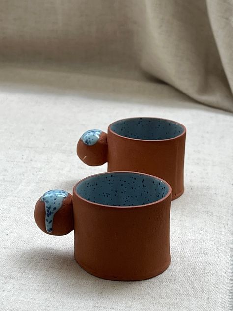 Let this terracotta espresso cup take you back in time with each sip of your coffee, Complete your home interior design with Stoneware blue speckled glaze coffee tumbler. This cup has a modern rustic small coffee cup design. The small mug has a ball handle, so your finger won't get cut in the tiny handle, and it is just the perfect size for single-shot coffee drinks.  Entirely handcrafted, ceramic cup, handmade without mould, with the slab method and fired at 1160 degrees. My inspiration for thi Different Mug Handles, Ceramic Souvenir Ideas, Terracotta Mug, Espresso Cup Ceramic, Ceramic Mug Handmade, Crafts Easy Diy, Espresso Cups Ceramic, Handmade Ceramic Mugs, Ceramic Handles