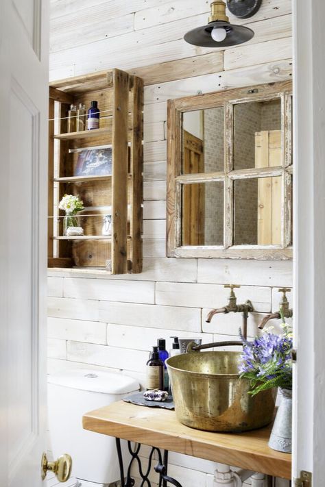 Compromises do have to be made in small spaces, but it is possible to contain all of the necessary bathroom features – your sink, mirror, storage etc. – if you're willing to miniaturise. This clever shelving unit started life as an apple crate, whilst the tiny mirror hides some modest shelves. Bathroom Decor Ideas Blue, Rustic Small Bathroom Ideas, Statement Bathroom, Apothecary Bathroom, Mirror Cupboard, Blue Bathroom Decor, Bathroom Layouts, Renovation Tips, Classic Bathroom