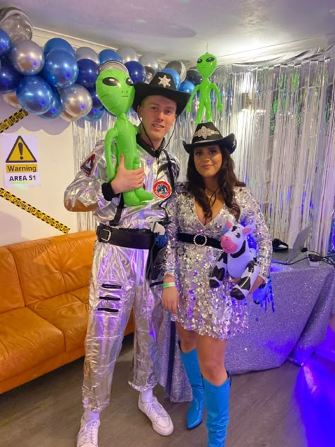 Space Cowboy Party decoration and costume inspiration #spacecowboy #decorations #costume #spacecowboycostume Space Cowboys Couple Costume, Cowboys And Aliens Party Outfit, Space Cowgirl And Alien Costume, Cosmic Cowboy Costume, Cowboys And Aliens Party Theme, Alien And Cowboy Party, Space Cowboy Costume Couple, Space Cowboy Halloween Costume, Space Cowboy And Alien Costume