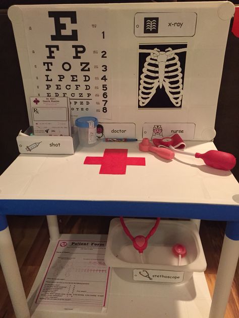 DIY Toddler Doctors Office Play Area Diy Doctor Play Area, Diy Role Play Area, Play Area In Classroom, Diy Play Doctor Office, Pretend Doctor Office, Diy Doctor Play Set, Doctor Pretend Play Set Up, Diy Doctor Office Pretend Play, Doctor Play Area For Kids