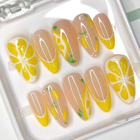 Hi 𝕭𝖆𝖇𝖊𝖘! ✨ Thank you for checking out our product 💜💚 Set details : Summer nail art collection 🌼🍋 Big 3d lemon on thumb, lemon nail art with leaves and yellow French tips. Shiny top. Included with your order: 10 hand-painted press on nails, prep application kit and a small gift 💖 To fit your nails perfectly we recommend purchasing a sizing kit.  You can always follow the measure guide to provide us with a size or a custom sizes of your nails in mm. 𝗜𝗺𝗽𝗼𝗿𝘁𝗮𝗻𝘁 - We will not be r Summer Nails Designs Fruits, Lemonade Nails Designs, Lemon Nail Art Designs, Yellow Aesthetic Nail Designs, Yellow Fake Nails, Cute Lemon Nails, Yellow Press On Nails, Food Themed Nails, 3d Lemon Nails