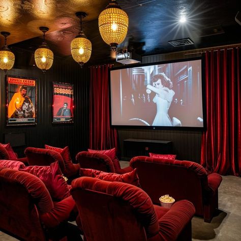 Vintage glamour home cinema room with red velvet seats, vintage film posters, and ornate lantern-style lighting fixtures, creating an intimate viewing experience. Movie Theater Room Decor, Cinema Room Decor, Home Cinema Room Ideas, Vintage Film Posters, Vintage Movie Theater, Theater Room Decor, Film Screening, Glamour Home, Theatre Interior