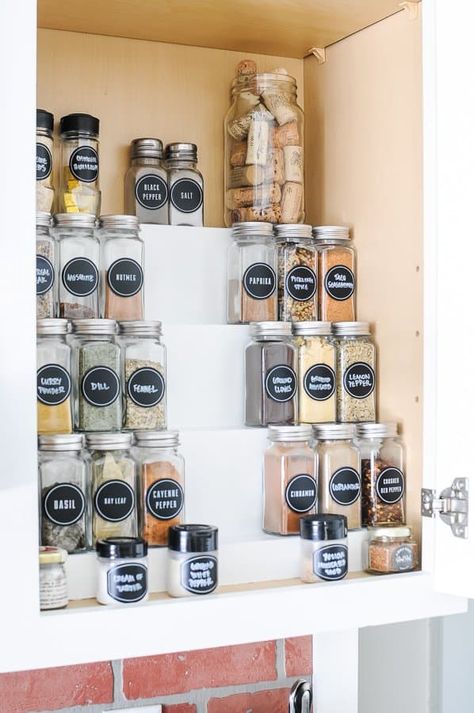 The Best DIY Hack for Organizing Spices in a Cabinet - Build a DIY tiered spice rack and get your spice cabinet organized! This organization hack uses the vertical space of your cupboard to keep your countertop and drawer space clear while making it easy to see all of your spices. Paint yours white or stain it for a rustic or vintage look. Other DIY organization ideas in this post too!#diyorganizationideas #diyorganization#spicerack #diy Spice Rack Cabinet Organization, Classy Spice Rack Ideas, Spice Ideas Storage, Narrow Spice Cupboard Organization, Cheap Spice Organization, Spice Organization On Counter, Spice Organization Countertop, Cute Spice Organization, Large Spice Jar Organization