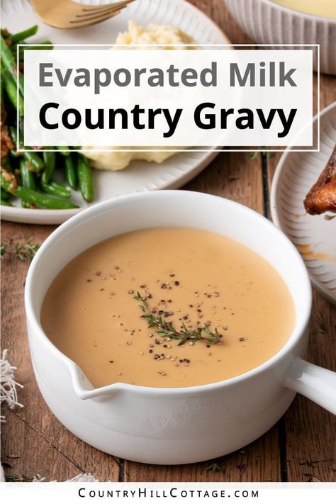 Evaporated milk gravy is rich, smooth, and ultra-creamy. The recipe is easy to make with a handful of ingredients and tastes delicious with sausage and biscuits, roasted turkey, steak, fried chicken, mashed potatoes, and more! Evaporated milk may seem a strange addition to gravy. But if you enjoy Southern cuisine, you know biscuits and sausage gravy. This delicious dish uses evaporated milk to create a rich and thick gravy with a velvety mouthfeel and creamy texture. | CountryHillCottage.com Milk Gravy Recipe Country, Recipes Using Evaporated Milk, Milk Gravy Recipe, Sausage And Biscuits, Fried Chicken Mashed Potatoes, Savory Hand Pies Recipes, Brown Gravy Recipe Easy, Country Gravy Recipe, Biscuits And Sausage Gravy