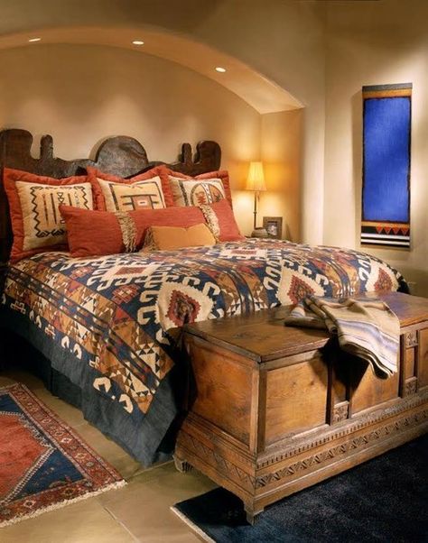 Santa Fe southwest style guest bedroom with stone floor and plaster walls. hand carved mesquite bed with colorful bedding, Navajo weavings | Susan Hersker, ASID - Interior Designer of Arizona #interiordesign #bedroom Southwestern Home Design, Southwestern Bedroom, Western Comforter Sets, Colorful Bedding, Southwestern Home, Interior Design Images, Stone Floor, Wood Floors Wide Plank, Traditional Style Homes