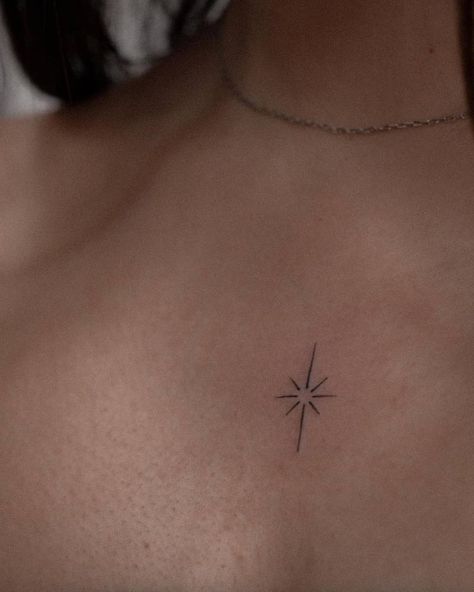 Minimalistic north star tattoo located on the chest. Minimalist Chest Tattoo For Women, Sparkle Tattoo On Chest, North Star Back Tattoo, Elegant Tiny Tattoos, Small Star Chest Tattoo, Minimal North Star Tattoo, Tattoos Middle Of Chest Women, Chest Sparkle Tattoo, Stars On Chest Tattoo