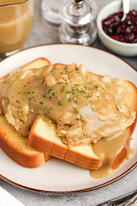 A hot turkey sandwich is an easy supper that's made with gravy and is a great way to use up leftovers from a holiday dinner. Recipes like this one are sure to become family favorites! It's simple to dress it up with bacon or melted cheese, too. Try it with cranberry sauce or make a tasty avocado mayo. #turkeysandwich #hotturkeysandwich #leftovers #spendwithpennies Open Face Turkey Sandwich Gravy, Turkey And Gravy Sandwiches, Hot Turkey Sandwich With Gravy, Open Faced Turkey Sandwich, Sandwiches Board, Hot Turkey Sandwich, Turkey Sandwich Recipes, Open Face Turkey Sandwich, Hot Turkey Sandwiches