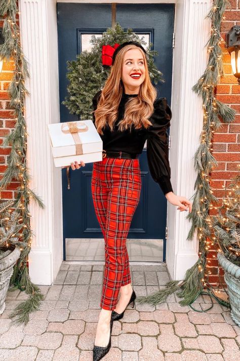 girl smiles holding present wearing plaid pants, a ruffled top and black glitter heels for christmas Preppy Christmas Outfits Women, Home Holiday Party Outfit, Holiday Womens Outfits, Christmas Work Outfits Women, Christmas Tea Party Outfit, Holiday Festive Outfits, Green Christmas Outfit Women, Women’s Christmas Outfit, Christmas Eve Outfits Church