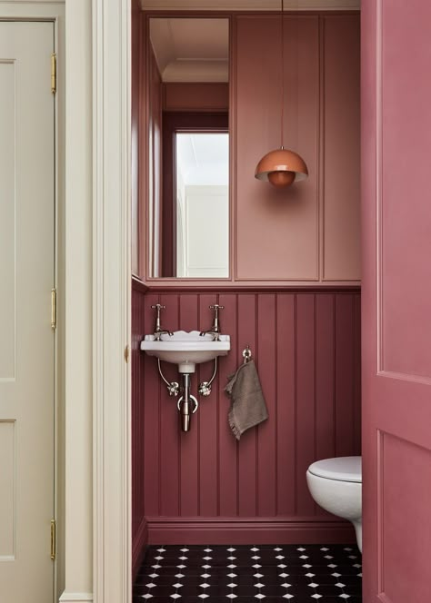 Paneled Bathroom With Wallpaper, Prewar Bathroom Remodel, Wallpaper Paneling Ideas, Bathroom Wall Cubby, Pop Of Color In Bathroom, Walls Trim Same Color, Trim In Bathroom Wall, Terracotta Painted Bathroom, Rust Colored Bathroom Walls