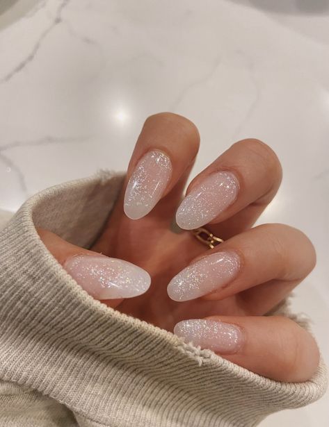 Simple New Years Nails Almond, White Nails With Glitter Almond Shape, Minimal Nye Nails, Nye Almond Nails, Sparky White Nails, Minimal New Years Nails, Light Holiday Nails, Winter Nail Inspo 2023 Almond, Simple Winter Nails Acrylic Almond