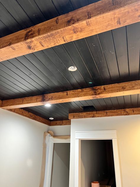 Wood Beam Basement Ceiling, Basement Wood Beams, Industrial Beams Ceiling, Ceiling Ideas Beams, Black Tin Ceiling Ideas, Pine Wood Ceiling Ideas, Black Ceiling Vaulted, Ceiling Support Beam Ideas, Black Ceiling Farmhouse