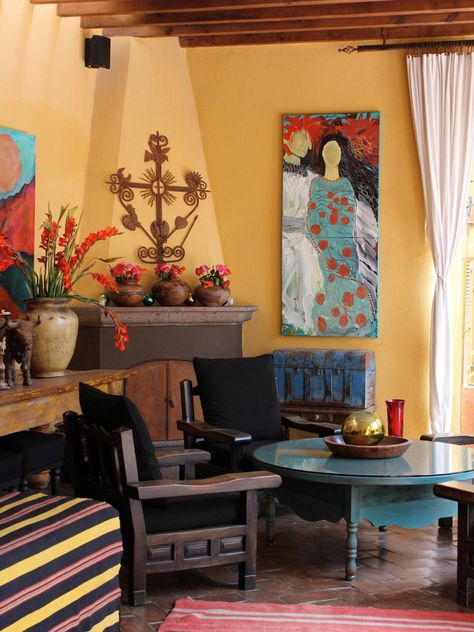 Mexican-Inspired Outdoor Roomhide  HGTV fan allende wanted a lot of color in her outdoor space. To get a Mexican-inspired look, paint your patio walls a warm bold color, and spray-paint old furniture for a rustic look. You can find textiles and antiques at flea markets, and grocery-store plants add freshness to the space. Luxury Outdoor Spaces, Mexican Style Decor, Ideas Salon, Southwest Living, Southwest Home Decor, Mexican Interiors, Painting Old Furniture, Spanish Decor, Southwestern Home