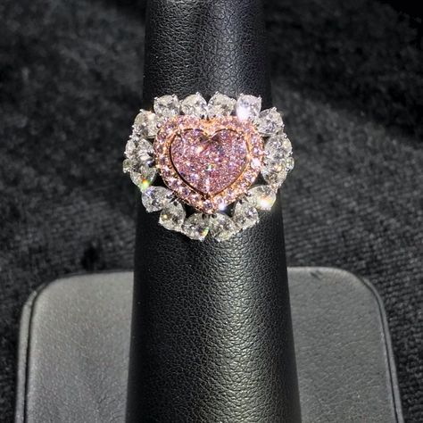 Approximately 1.00 Carat Heart Shape GIA Certified Faint Pink 3.00 Carat Total VVS1 Clarity Set in 18k White Gold Fancy Pink Diamond Halo 16 White Pear Shapes Order will be ready to ship in 3-4 weeks. Pink Heart Engagement Rings, Pink Diamond Wedding Rings, Fancy Pink Diamond Ring, Heart Shaped Wedding Rings, Pink Heart Rings, Heart Diamond Ring, Pear Shapes, Pink Diamonds Engagement, Heart Shaped Diamond Ring