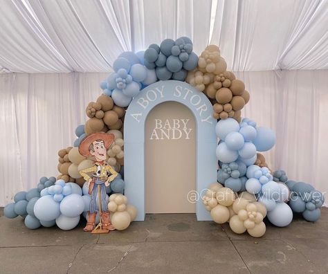 @crafty_wildflower_ on Instagram: "It’s A Boy Story!🚀📚💙 Congratulations to the parents to be! • • #babyontheway #babyshower #woody #toystoryparty #toystory #disney #itsaboy #babyshowerdecor #backdropdecoration #ballooninstallation" Toy Story Baby Shower Backdrop, It’s A Boy Story Baby Shower Centerpieces, Boy Toy Story Baby Shower Theme, It’s A Boy Story Decor, Toy Story Baby Shower Ideas Decorations, Toy Story Themed Baby Shower (boy), Boy Baby Shower Themes Fall, Baby Shower Toy Story Theme, Toy Story Theme Baby Shower Ideas