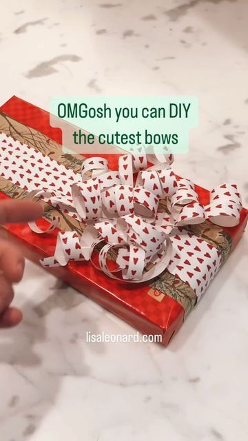 Lisa Leonard on Instagram: "😱 Friends, these bows are so easy and totally adorable! Any wrapping paper will work. Do you LOVE it? Please like and share and let me know if you try it ❤�️" Easy Gift Bows With Ribbon, Bows Out Of Wrapping Paper Diy, How To Wrap With Ribbon, Make A Bow From Wrapping Paper, Christmas Bows Diy Present, Bows On Christmas Presents, How To Make Bows From Wrapping Paper, Leftover Wrapping Paper Bow, Make Bow Out Of Wrapping Paper