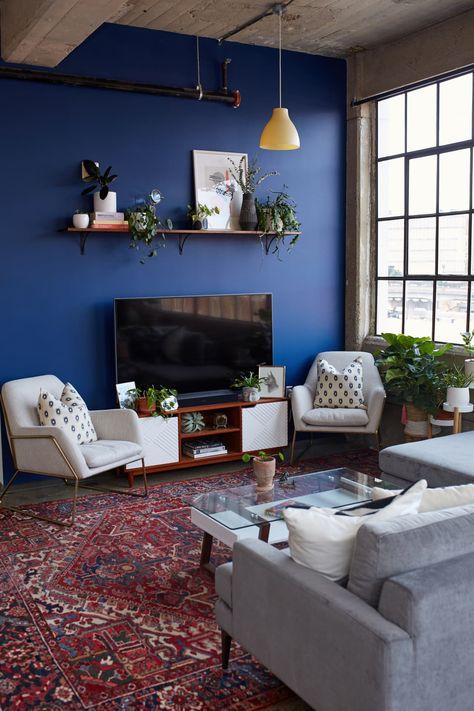 Warm Industrial Knoxville Rental Apartment Tour | Apartment Therapy Cobalt Blue Walls Living Room, Accent Wall Blue Living Room, Blue Wall Interior Living Room, Cobalt Blue Home Decor, Cobalt Blue Interior Design, Cobalt Blue Accent Wall, Cobalt Blue Interior, Blue Wall Apartment, Cobalt Blue Room