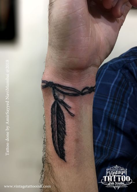 Feather On Wrist Tattoo, Mens Native Tattoos, Native Sleeve Tattoos For Guys, Small Fill In Tattoos For Sleeve Men, Wrist Tattoos Men Band, Tattoo Ideas For Men Arrow, Simple Wrist Tattoos Men, Men Feather Tattoo Ideas, Forearm Man Tattoo