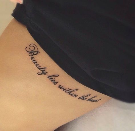 Beauty lies within the heart Pure Heart Tattoo Words, Heart With Quote Tattoo, Love Yourself Tattoos For Women, Words In Heart Shape Tattoo, Qoute Tattoo On Thigh, Side Quote Tattoos, Tattoo Quotes For Women, Side Tattoos, Tattoos For Black Skin