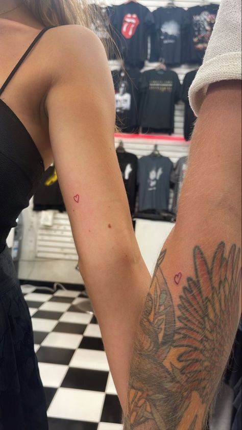 Half Heart Matching Tattoos, Aesthetic Couples Tattoos, Kylie Heart Tattoo, Matching Red Heart Tattoos, Minimal Matching Tattoos Couple Tat, Matching Heart Tattoos Couple, Couple Minimal Tattoo, Subtle Relationship Tattoos, Mini Red Heart Tattoo