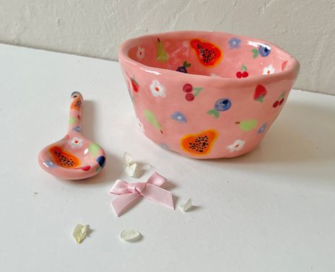 a hand pinched, hand painted stoneware ceramic bowl, with a matching spoon handmade with love 🤎 so some small imperfections possible Fun Ceramic Bowls, Hand Painted Bowl, Painted Ceramic Bowl, Whimsical Pottery, Ceramic Fruit Bowl, Handmade Ceramic Bowl, Ceramic Fruit, Pink Fruit, Hobby Ideas