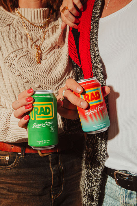 Friends sharing healthy soda together
Ginger Citrus soda
Tropical Punch soda
Healthy soda Drink Product Photography With Model, Can Drinks Aesthetic, Ephemeral Aesthetic, Soda Photoshoot, Drink Photography Ideas, Soda Branding, Can Of Beer, Soda Flavors, Soda Shop