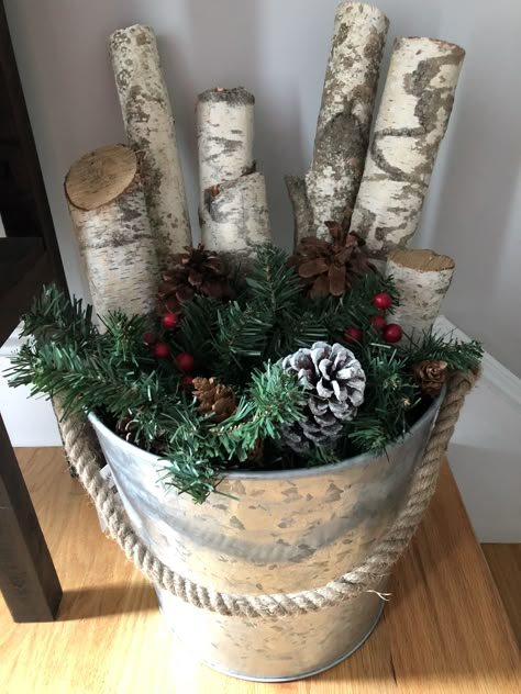 Birch Christmas Bucket, Christmas Tree In Tin Bucket, Birch Tree Branches In Pot, Christmas Tree Tin Bucket, Silver Bucket Decor Ideas, Christmas Bucket Decoration, Crafts With Birch Wood, Christmas Decor With Birch Branches, White Birch Logs Decor Rustic Christmas