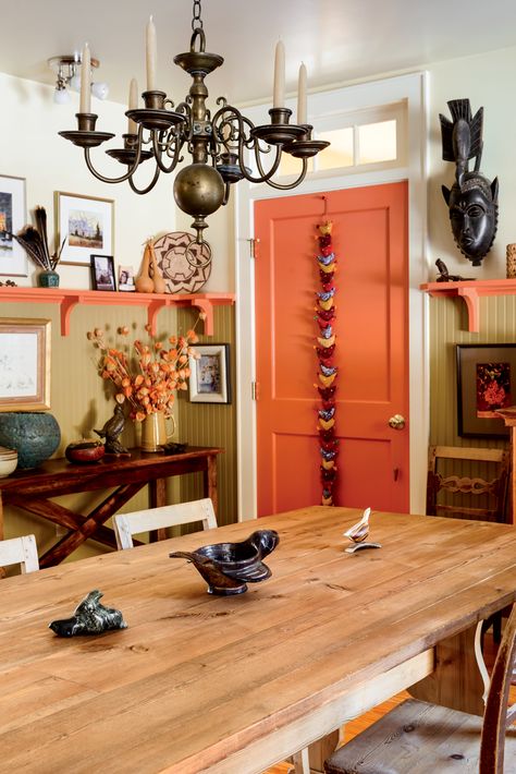 The dining room’s high beadboard wainscoting strikes a traditional note amid exotic artifacts. Painted Chair Rail Dining Room, Beadboard Wainscoting Kitchen, Kitchen Wainscoting, Beadboard Living Room, Beadboard Dining Room, French Farm Table, Painted Beadboard, Beadboard Wall, Wainscoting Kitchen