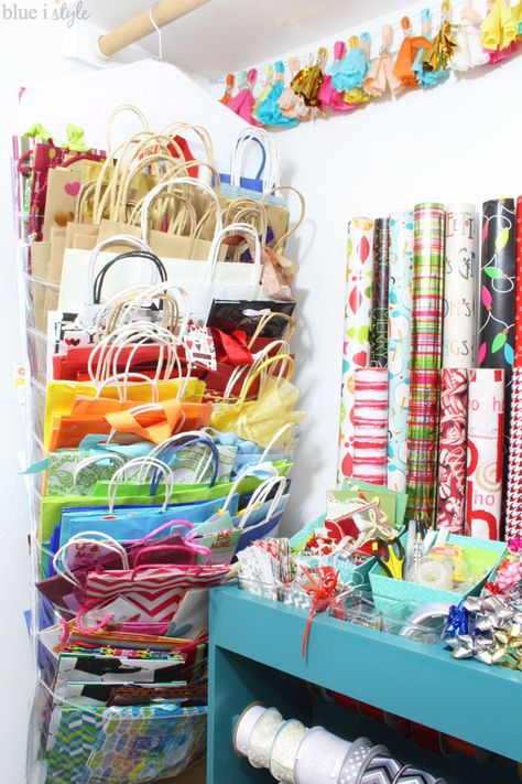 Take advantage of that under-utilized space in your guest room closet to organize all of your gift wrap supplies - from wrapping paper and gift bags, to ribbon and gift tags, and even greeting cards and stationery...tips to organize it all! Gift Bags Organizer Storage Ideas, Wrapping Supplies Storage, Organization Ideas For Gift Bags, Gift Wrap And Bag Storage, Hanging Office Organizer, Organizing Gift Bags And Tissue Paper, How To Organize Gift Bags And Tissue Paper, Gift Bag Organizer Storage Ideas, Gift Bag And Tissue Paper Organization