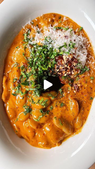 Carolina Gelen on Instagram: "BEANS ALLA VODKA, just like penne alla vodka, but beans - creamy butter beans coated in a silky, spicy vodka sauce served with garlic-rubbed toast, a 20-minute dinner that feels like a hug in a bowl. Find the full recipe in the link in my bio   #penneallavodka #vodkasauce #beans #butterbeans #quickdinner #vegetarianrecipes #cookingvideo #food #comfortfood #easyrecipes  1 shallot, finely chopped 1 heaping tablespoon tomato paste 4 garlic cloves, thinly sliced 1/2 teaspoon chile flakes, plus more to taste A splash of vodka, can be substituted with water 1/2 cup heavy cream, can be substituted with full-fat coconut milk 1/2 cup water 1 x 15 oz (500 g) can butter beans, drained and rinsed 1/4 cup freshly grated Parmigiano Reggiano, plus more for topping A knob of Spicy Vodka Sauce, Can Butter, Butter Beans Recipe, 20 Minute Dinners, Penne Alla Vodka, Canned Butter, Alla Vodka, Vodka Sauce, Butter Beans