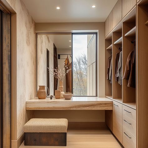 This sleek closet design includes a mix of open storage and concealed compartments for a clean, modern look Walk In Closet With Makeup Vanity, Closet With Makeup Vanity, Modern Walk In Closet, Modern Closets, Closet Idea, Minimalist Homes, Kitchen Entrance, Walk In Closet Design, Closet Design Layout