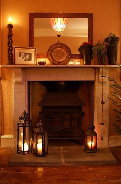 lanterns on mantels | very pretty all lit up Farmhouse Fireplace Decor, Lanterns Fireplace, Candles In Fireplace, The Mantle, Farmhouse Fireplace, Fireplace Hearth, Home Fireplace, Cozy Fireplace, Fireplace Decor