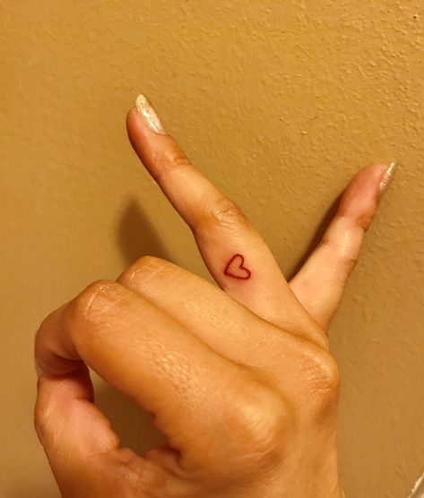 Red heart finger tattoo ♥️ Small Tattoos Heart Finger, Red Tattoo On Wrist, Small Red Finger Tattoo, Heart On Thumb Tattoo, Tattoo Heart Finger, Small Red Heart Tattoo On Finger, Red Heart Hand Tattoo, Red Tattoo Finger, Red Ink Finger Tattoo