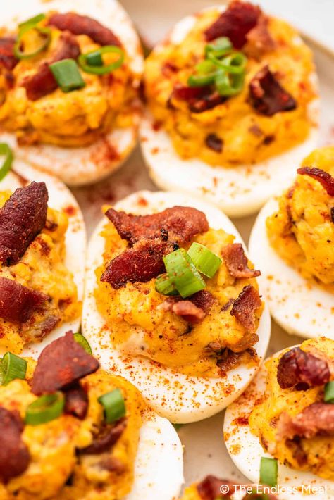 PIN TO SAVE FOR LATER! Deviled Eggs with Bacon are the ultimate deviled eggs. We add some caramelized onions and a little cheddar cheese to totally take these over the top. It's an appetizer recipe that gets rave reviews every time it is served. #theendlessmeal #eggs #deviledeggs #devilledeggs #bacon #baconeggs #bacondeviledeggs #easter #appetizer #appetizerrecipes #easterrecipes #partyrecipes #eggrecipes Best Deviled Egg Recipe Ever, Bacon Deviled Eggs Recipe, Deep Fried Deviled Eggs, Deviled Eggs With Bacon, Easter Appetizer, Easy Bacon Recipes, Eggs With Bacon, Thanksgiving Deviled Eggs, Fried Deviled Eggs