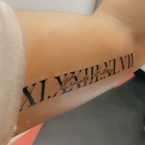 Roman Numeral Tattoo With Name, Roman Numeral Tattoo Arm, Numerals Tattoo, Roman Numbers Tattoo, Birthdate Tattoo, Grandma Tattoos, Ambigram Tattoo, Believe Tattoos, Simple Forearm Tattoos