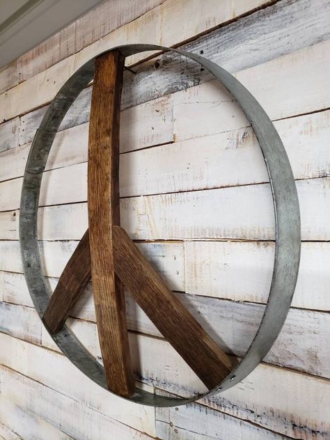 Metal Peace Sign, Diy Whiskey Barrel, Wood Peace Sign, Metal Wire Sculpture, Diy Whiskey, Barrel Crafts, Wine Barrel Art, Eclectic Garden, Barrel Art