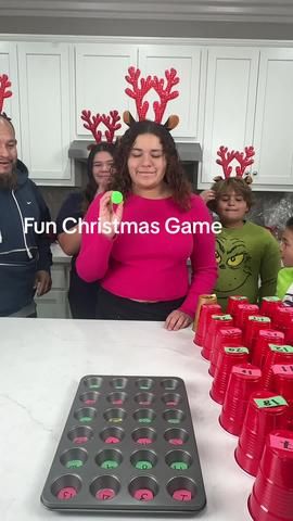 Super Fun Holiday Game 🧑‍🎄 Dad and family bounce ping pong balls int... | christmas games ideas 2023 | TikTok Family Christmas Games With Ping Pong Balls, Ping Pong Bounce Game, Muffin Tin Game Christmas, Gift Pong Game, Christmas Pong Party Games, Christmas Muffin Tin Game, Muffin Tin Game, Ping Pong Prize Game, Muffin Tin Christmas Game