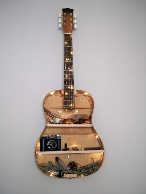 DIY guitar shelf Refurbished Guitar Ideas, Diy Guitar Shelf, Guitar Diy Decor, Acoustic Guitar Decoration, Guitar Decor Ideas, Guitar Art Diy, Vintage Camera Decor, Guitar Decor, Guitar Shelf