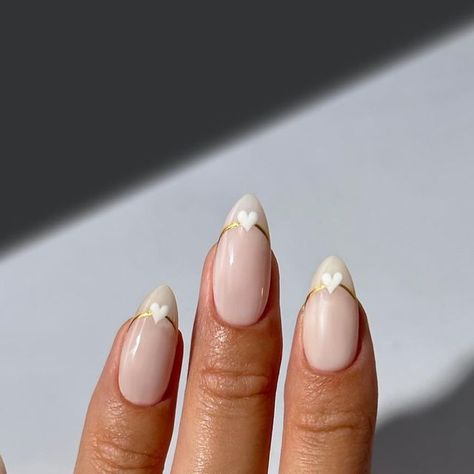 the nailologist🍒🌸🦋🌈✨ on Instagram: "Minimal white nails with gold chrome and white heart detailing 🤍✨ #nails #nailinspo #nailart #weddingnails #bridalnails #valentinesnails #whitenails" White And Gold Heart Nails, Gold Hearts Nails, Valentines Day Nails Gold, Gold Valentine Nails, White Nails With Gold Design, Hen Nails, Gold Heart Nails, White Valentines Day Nails, White Valentines Nails