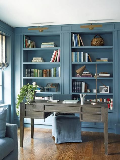 This home office room enjoys blue palette amongst a neutral foundation of natural wood grain flooring. Painted Bookshelf, Blue Home Offices, Transitional Home Office, Home Library Decor, Home Office Library, Blue Office, Library Office, Home Library Design, Studio Living