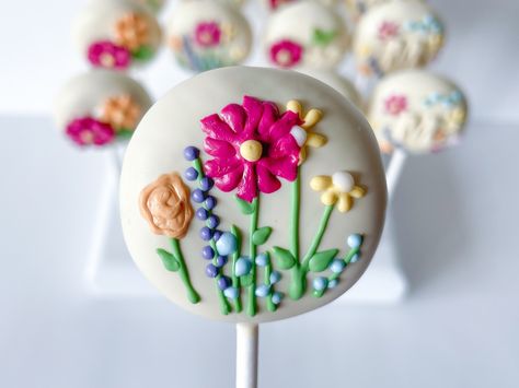 Matching Cake Popa for my last post. Wild & ONEderful was the theme. I love doing matching Cookie and Cake Pops! ✨Booked through October. Now accepting November orders. Click link in my bio to request a quote✨ #cakepops #cakepop #cakepopsofinstagram #treatmaker #wildandonederful #birthdaycakepops Wildflower Cake Pops, Wildflower Cake, Flower Cake Pops, Birthday Cake Pops, Flower Cake, Cake Pops, Cake