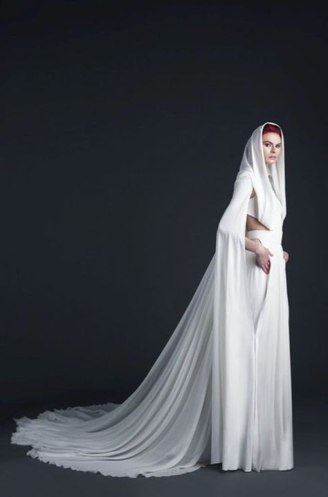 White crepe silk jumpsuit empowered by a white mousseline silk cape finished off with a white mousseline hooded veil which represents a combination of strength and beauty that makes up the Lebanese soul. Hooded Wedding Veil, Hood Veil, Hooded Veil, Consumer Board, Silk Veil, Silk Cape, White Veils, Silk Jumpsuit, White Dresses